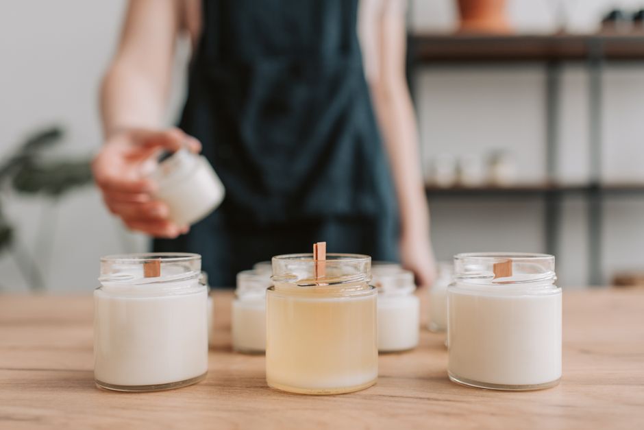 soy candle collection on wooden table